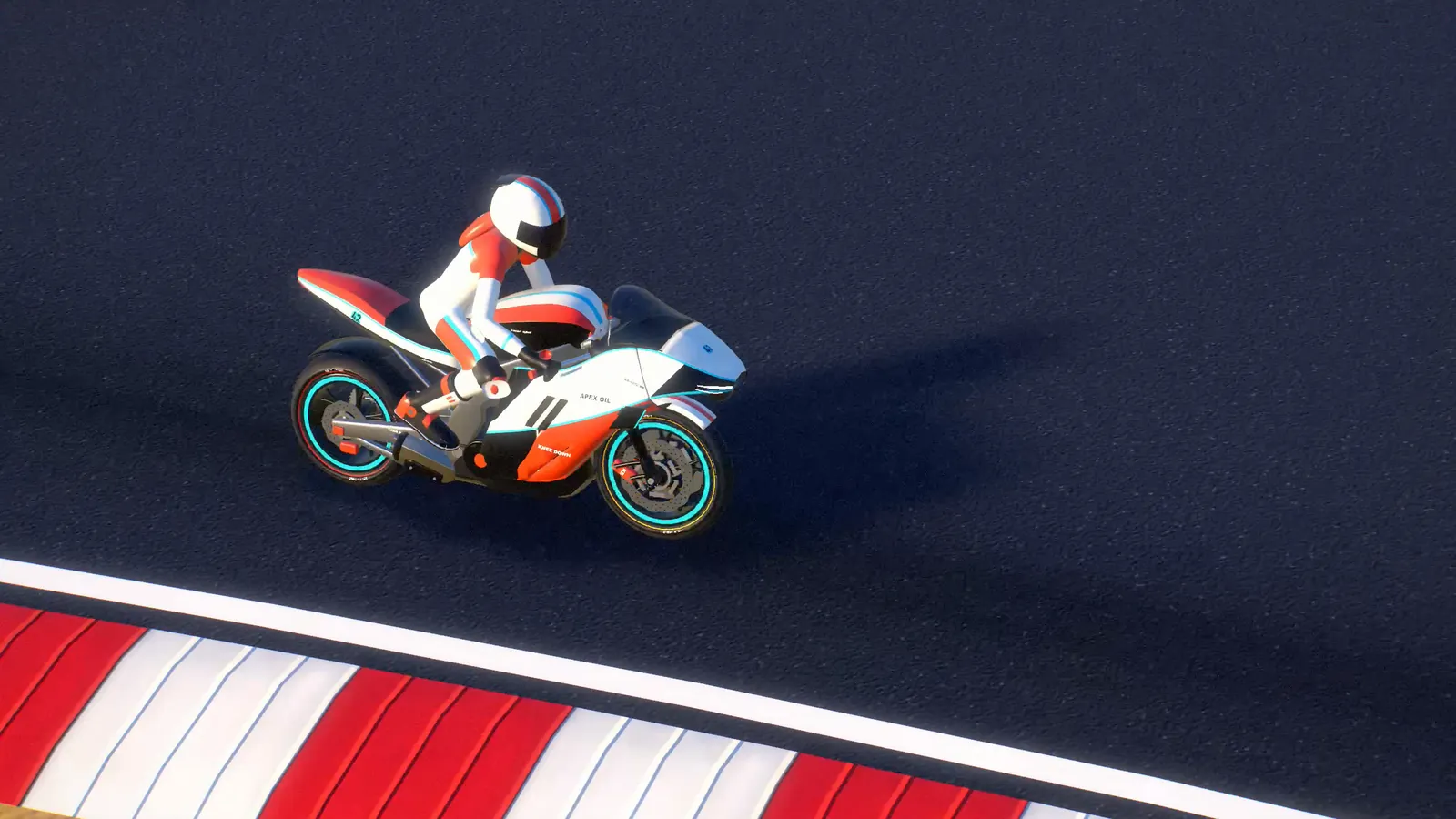 Replay camera: Alex leaning the KD-1000 RR through a red-and-white kerbed corner